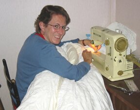Denise sewing labels.